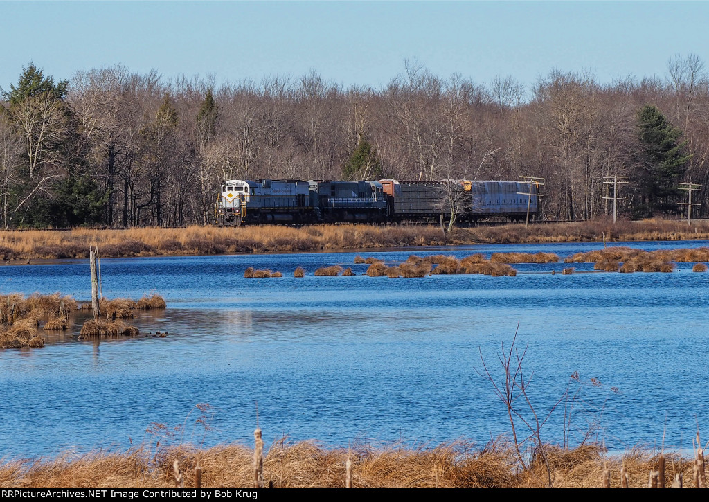 Eastbound local freight train PO-74 crosses the Snag Pond causeway